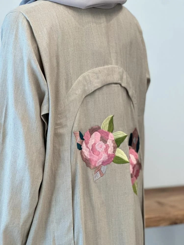 Luxurious beige linen abaya with elegant embroidery on the shoulder, front and back