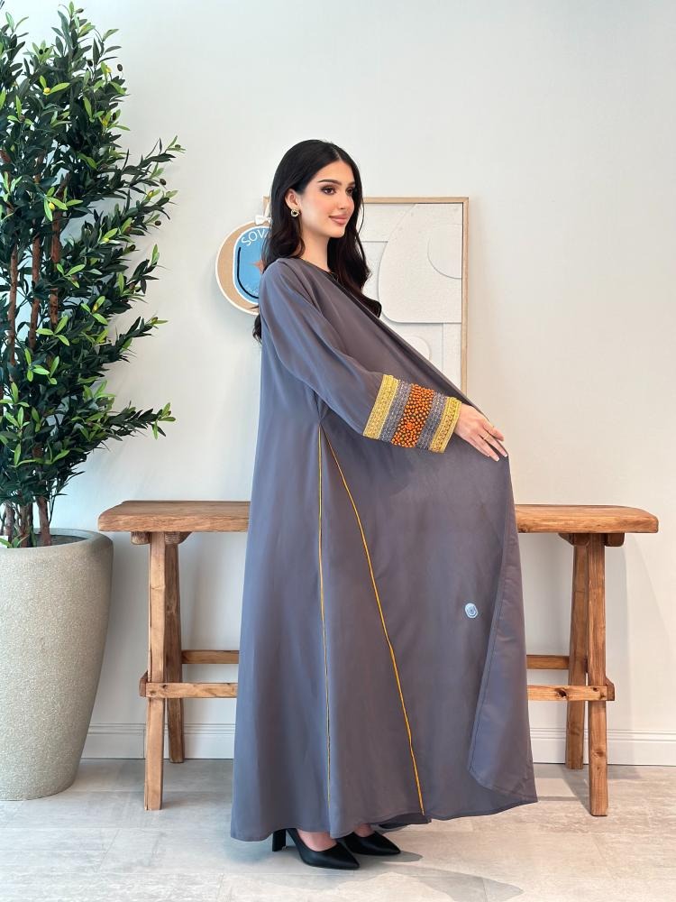 A distinctive half-cloche abaya with different luxurious embroidery