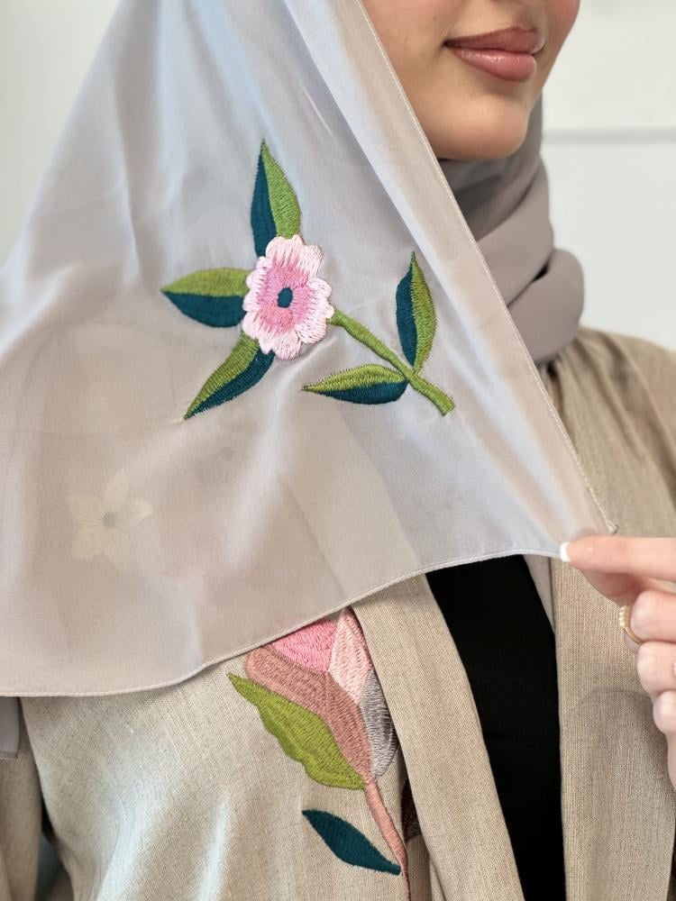 Luxurious beige linen abaya with elegant embroidery on the shoulder, front and back