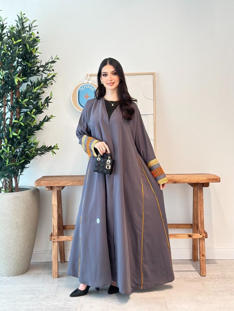 A distinctive half-cloche abaya with different luxurious embroidery