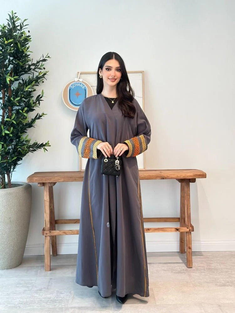 A distinctive half-cloche abaya with different luxurious embroidery