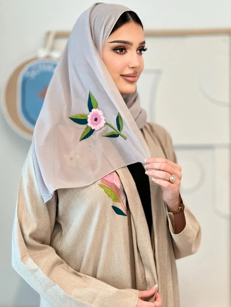 Luxurious beige linen abaya with elegant embroidery on the shoulder, front and back