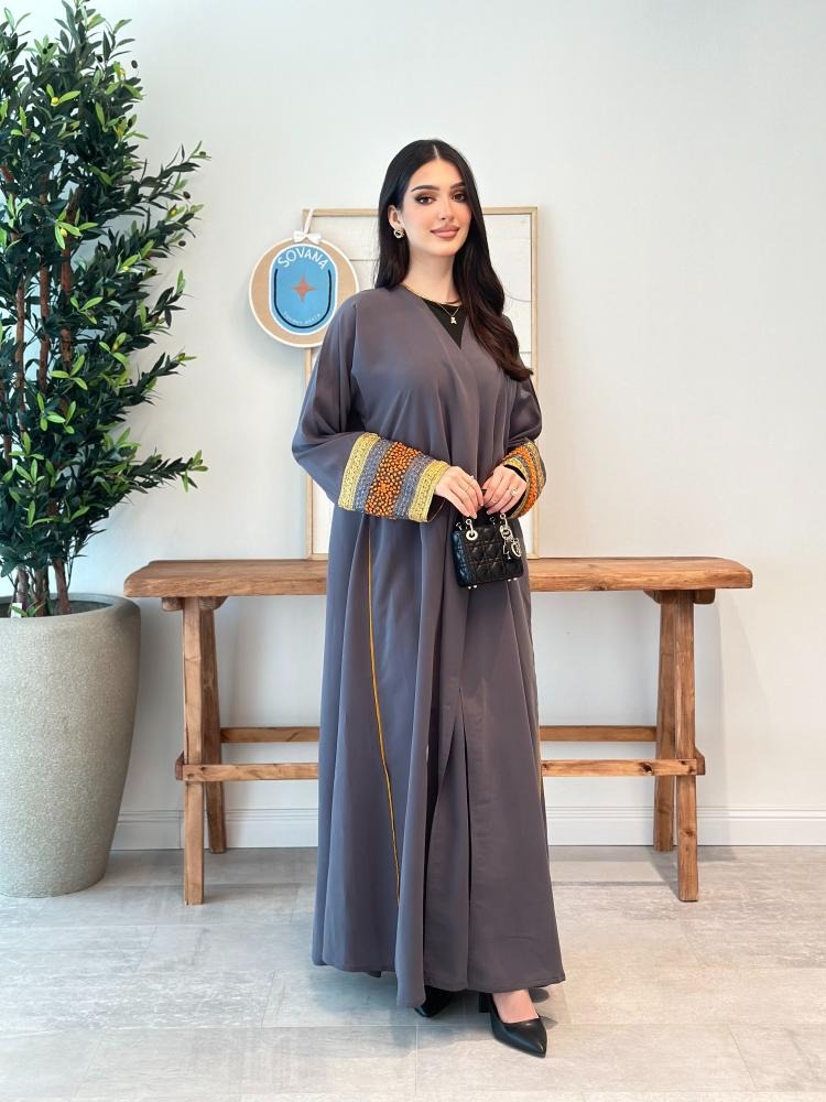 A distinctive half-cloche abaya with different luxurious embroidery