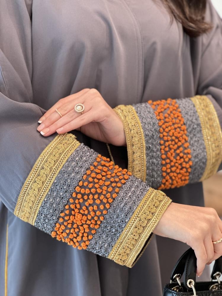 A distinctive half-cloche abaya with different luxurious embroidery