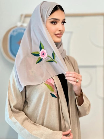Luxurious beige linen abaya with elegant embroidery on the shoulder, front and back