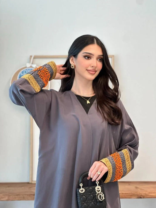 A distinctive half-cloche abaya with different luxurious embroidery